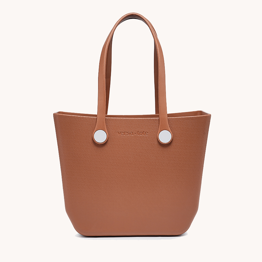 Rust brown everyday tote bag with two top handles and round metal grommets
