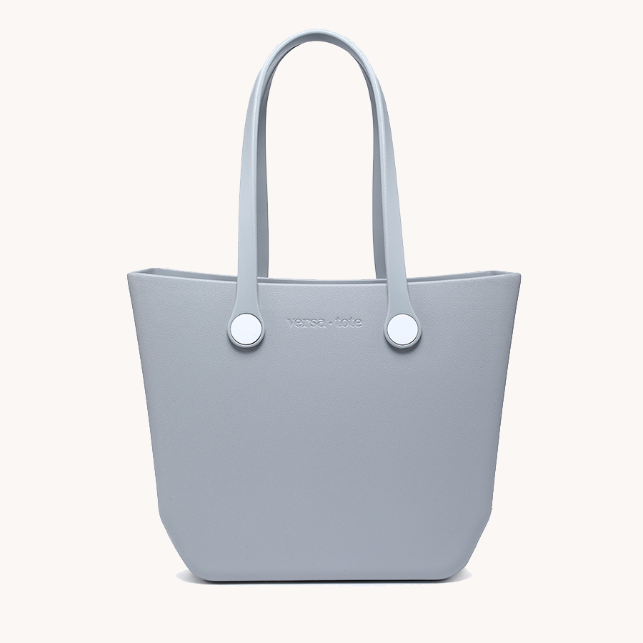 Light blue everyday tote bag with two top handles and round metal grommets