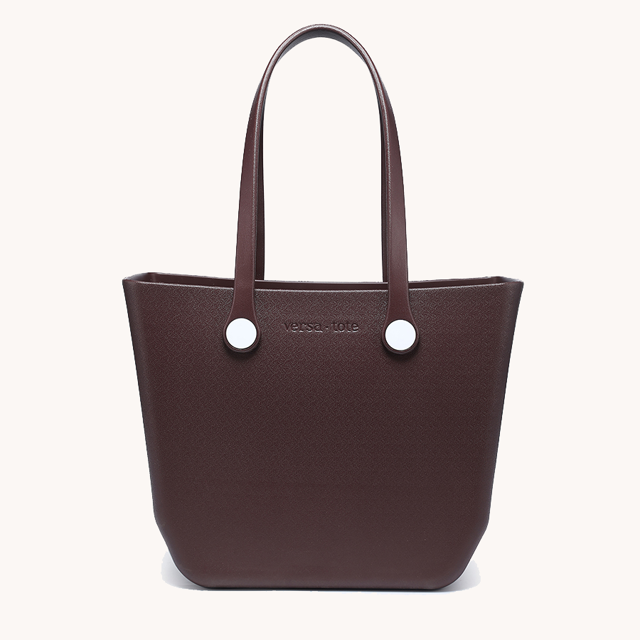 Dark brown everyday tote bag with two top handles and round metal grommets
