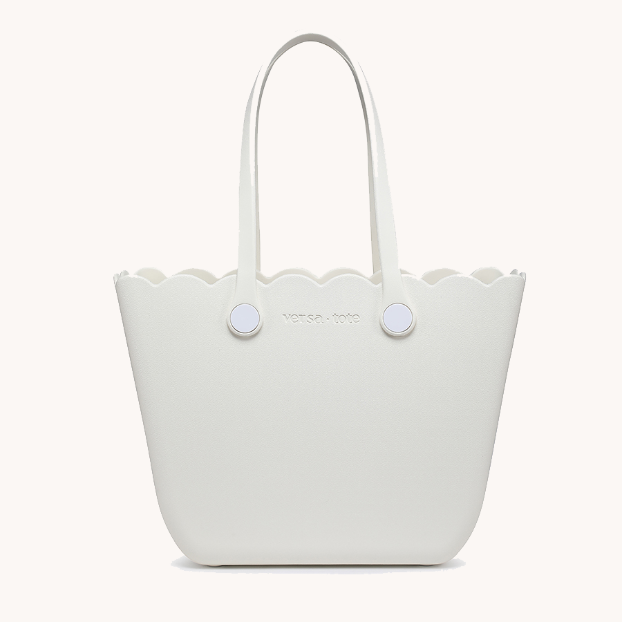 Scalloped tote in white with two round snap buttons and top handles