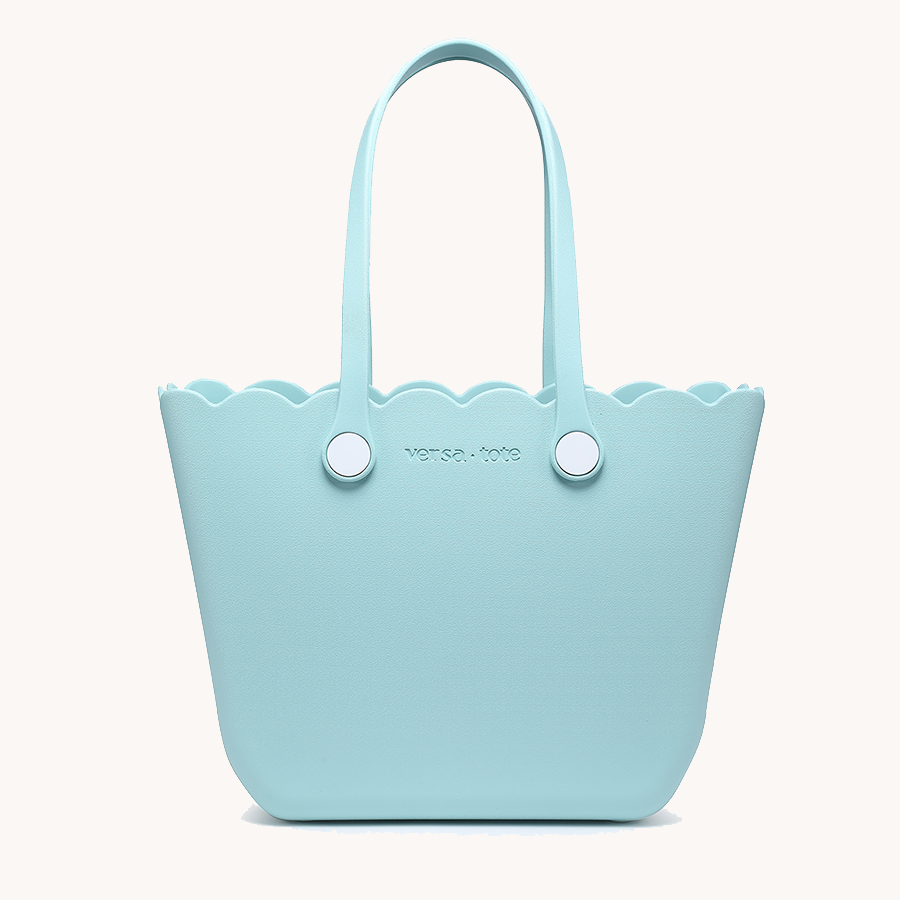 Scalloped tote in light blue with two round snap buttons and top handles