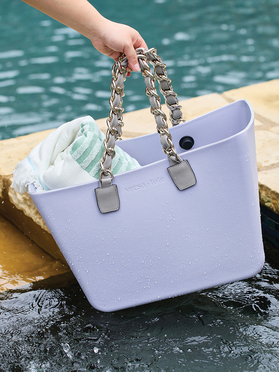 Silver chain strap with light grey end tabs on a lavender tote