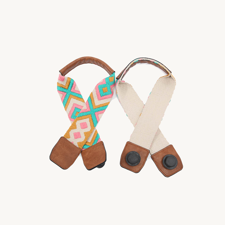 Guitar strap for Versa, pink/teal patterned webbing with brown leather ends