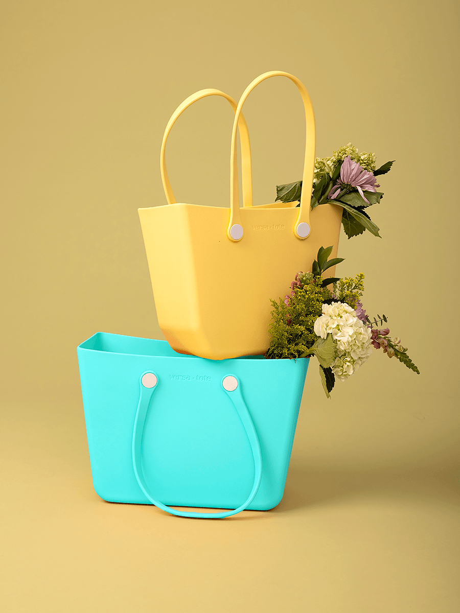 Rubber tote straps on two Versa Tote bags: yellow and turquoise