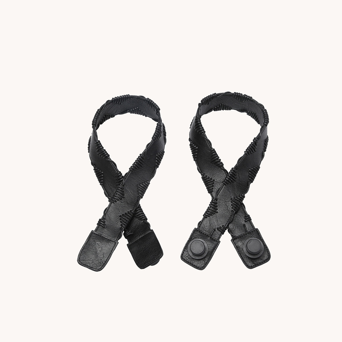 Pair of black yarn-stitched strap ends with round metal snaps and leather pads