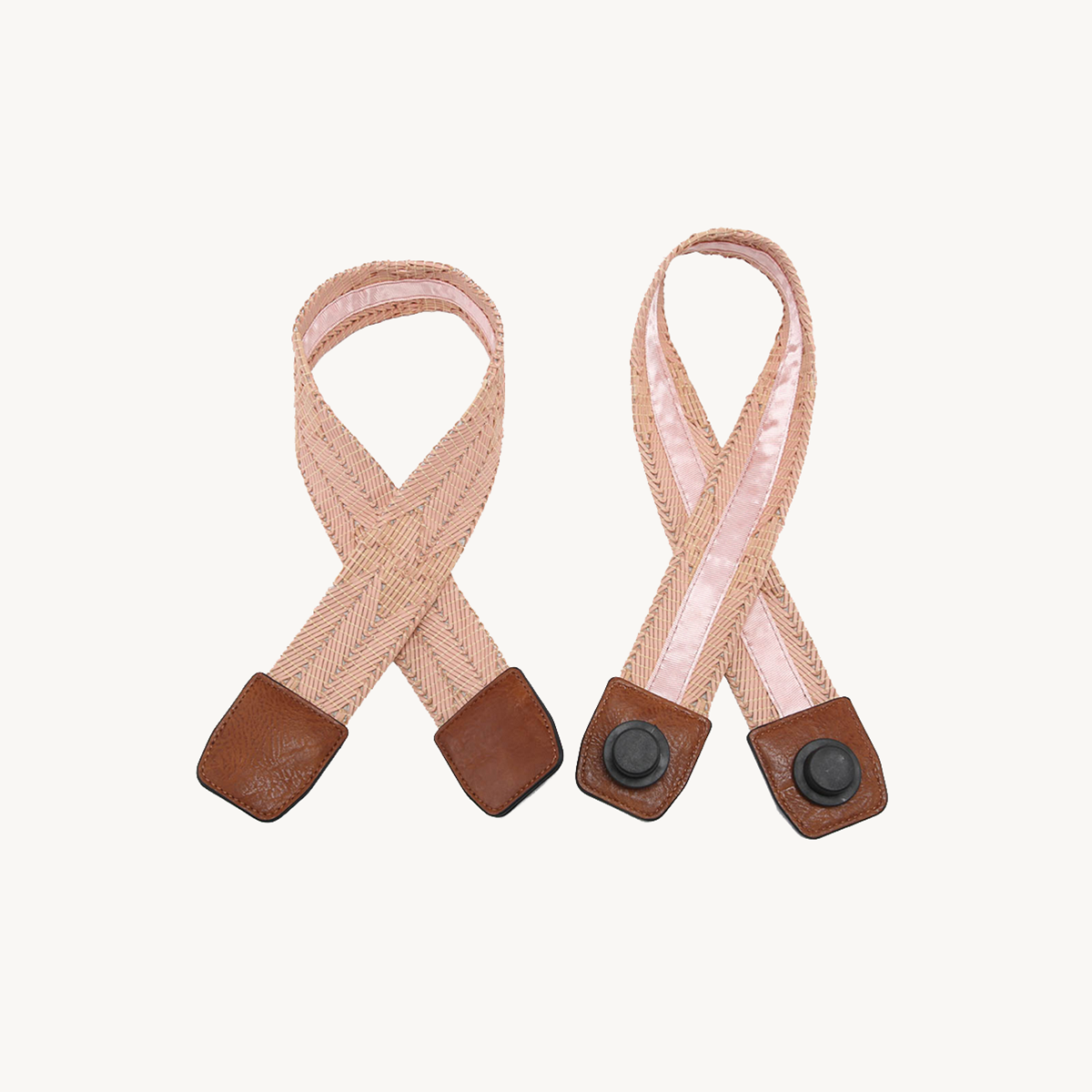 Pair of mauve woven straps with brown leather ends and snap buttons
